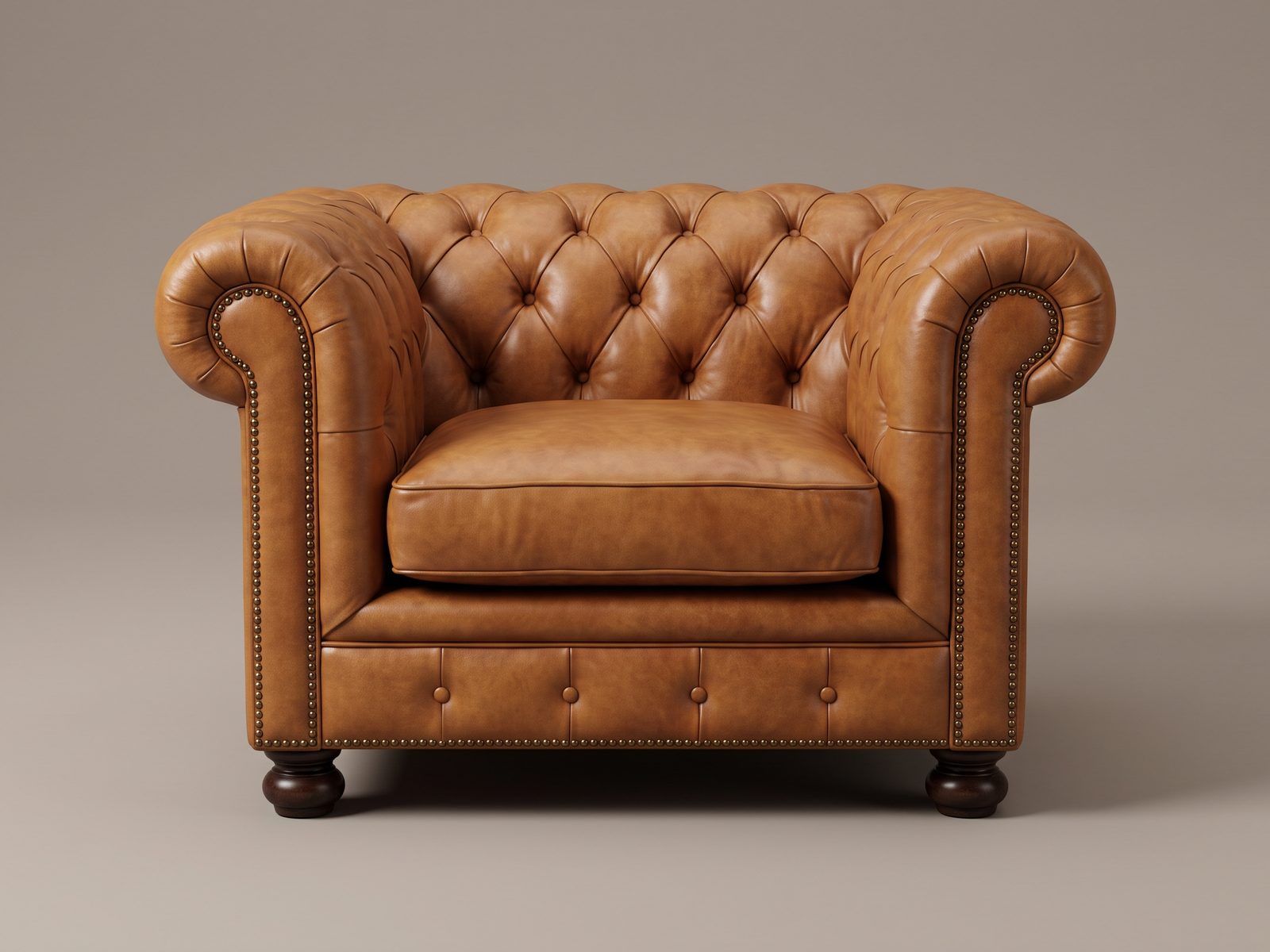Chesterfield armchair in aged tan leather with a single plain loose seat cushion, tufting on the back, arms and base panel only