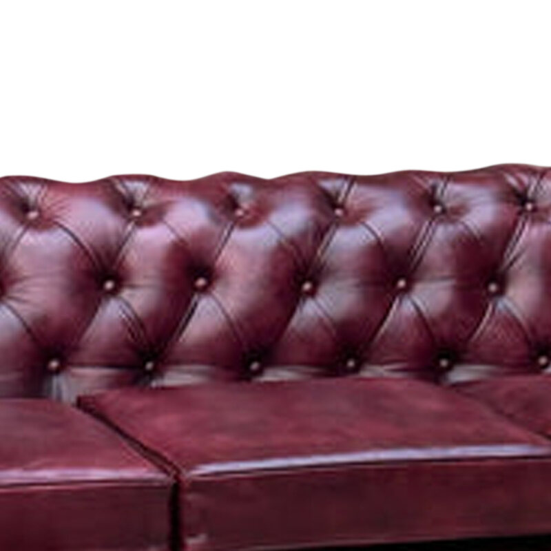 Oxblood Red top-grain buffalo leather on a hand-tufted Chesterfield